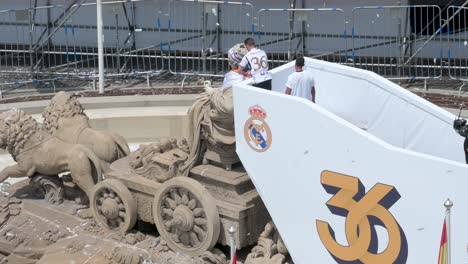 Real-Madrid-team-captain,-Nacho-Fernandez,-is-seen-decorating-the-Fountain-of-Cibeles-at-Cibeles-Square-celebrating-the-36th-Spanish-soccer-league-title