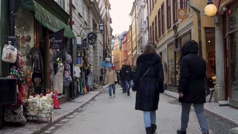 People-on-cozy-narrow-street-in-Old-Town-of-Stockholm,-static-view