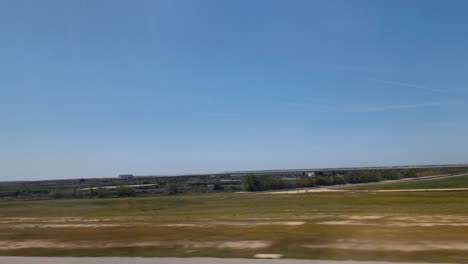 A-window-shot-on-take-off-from-Faro-Airport-Portugal-showing-the-coastline