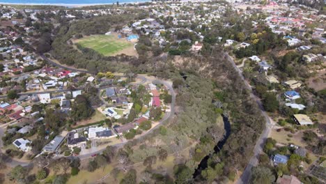 Drone-aerial-panning-down-from-the-beach-of-Victor-Harbour-to-a-river-system