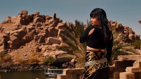 Asian-girl-with-long-black-hair-enjoys-sun-on-her-vacation-in-Egypt