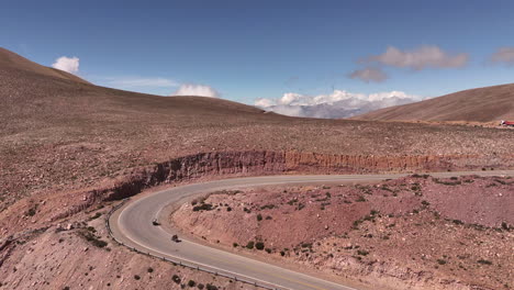 Aerial-Drone-Push-Over-2-Motorcycles-On-Route-52,-Jujuy-Province,-Argentina