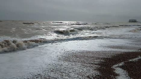 Ultra-Slow-Motion-Waves-Crashing-with-Sun-Reflection-on-Brighton-Beach-in-the-UK