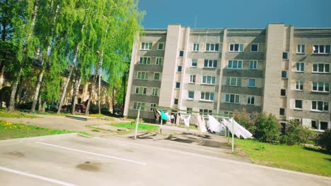 Bright-courtyard-in-between-apartment-blocks-with-bright-laundry-waving-in-wind