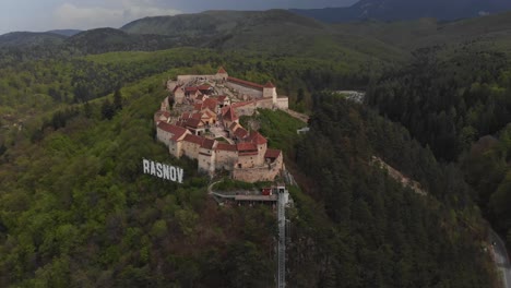 Rasnov-Fortress-Castle-Panoramic-View-Aerial-Drone-Fly-Above-Transylvania-Forest