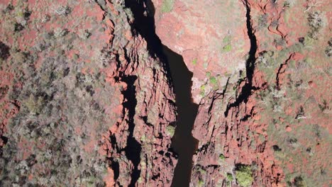 Drone-aerial-panning-up-over-Joffre-gorge-in-Karijini-national-park-revealing-barren-land