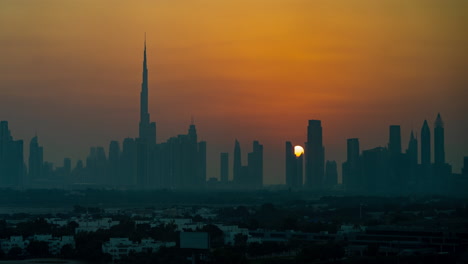 Timelapse,-Dubai-UAE-Downtown-Cityscape-at-Sunset,-Silhouette-of-Towers-and-Misty-Skyline