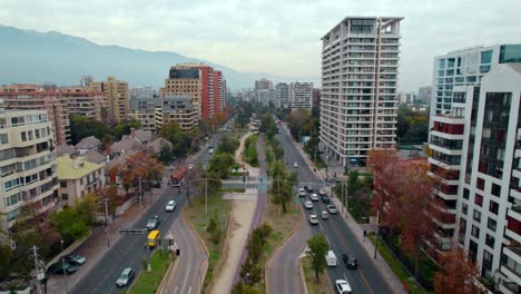 Bird's-eye-view-establishing-over-the-Americo-Vespucio-Sur-park-in-the-affluent-area-of-Las-Condes,-Santiago,-Chile