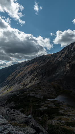 Vertical-4k-Timelapse,-Clouds-and-Shadows-Moving-Above-Mountain-Peaks-and-Alpine-Lake