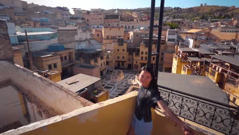 Asian-female-tourist-looking-at-Chouara-Tannery-Medina-in-Fez,-Morocco