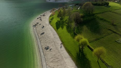 Aerial-Overhead-View-Of-Beach-On-Lake-Molveno-in-Trentino,-Italy