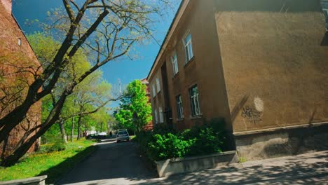 Baltic-city-explore-trip-through-street-of-Daugavpils-floating-observing-architecture-Dutch-angle-dolly-travel-to-right