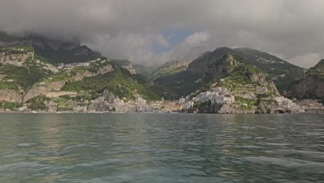 Approaching-the-town-of-Amalfi-by-ferry,-Amalfi-is-a-beautiful-town-of-the-Amalfi-coast,-further-view