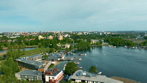 Aerial-approaching-shot-of-port-with-boats-at-River-in-Olsztyn-Town