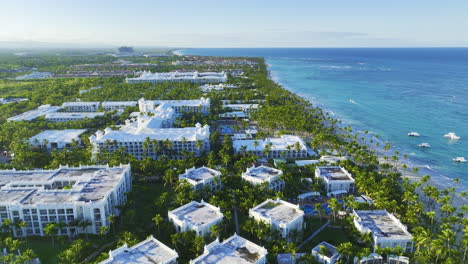 Hotels-And-Resorts-Surrounded-By-Palm-Trees-On-Caribbean-Coast-In-Bavaro,-Dominican-Republic