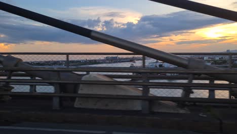 Driving-on-Bridge-Between-Cebu-City-and-Mactan-Island-at-Sunrise,-Passenger-POV,-Philippines