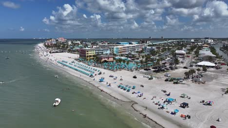 Beach-drone-approach-towards-Margaritaville-at-Ft-Myers-beach,-Florida