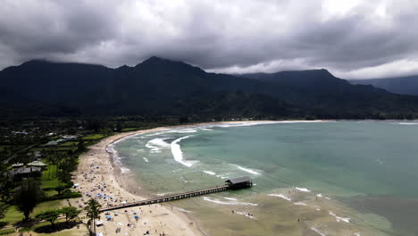 High-Aerial-Turn-Over-Hanalei-Bay-on-Busy,-Cloudy-Day