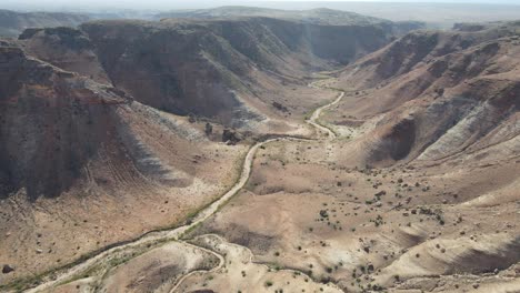 Drone-aerial-panning-left-and-down-through-the-middle-of-Charles-knife-gorge