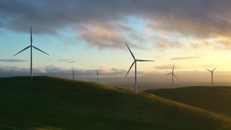 Aerial-view-of-wind-turbines-on-top-of-hills-in-the-highlands-of-California,-USA