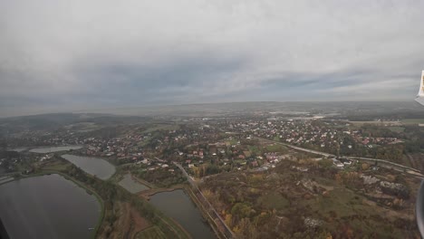 View-from-the-window-at-passenger-seat-in-airplane-flight-to-Krakow-city-Poland