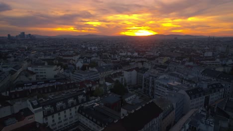 Aerial-Shot-of-Old-City-Vienna,-Austria-at-Dusk-Sunset