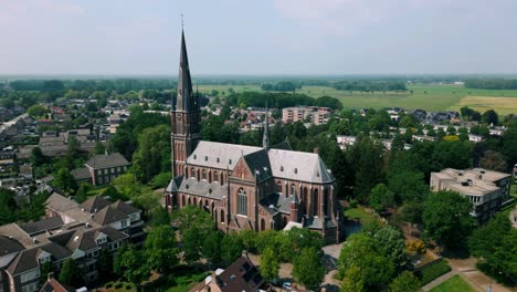 Orbit-around-Budel-catholic-church-in-Brabant-agriculture-countryside