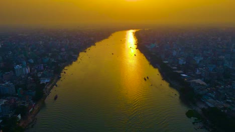 Aerial-over-Buriganga-River-at-Golden-Hour-in-Dhaka,-Bangladesh