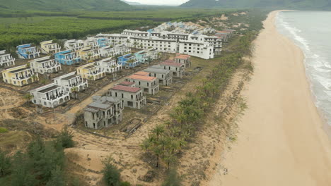 Slow-Motion-Track-Right-Past-Huge-Derelict-Holiday-Resort-In-Lang-Co-Vietnam