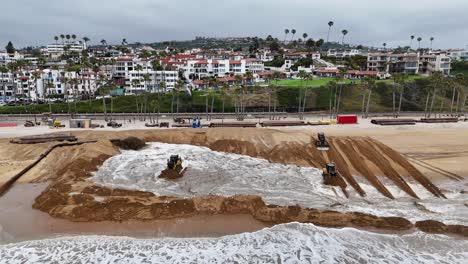 Bulldozers-move-sand-on-San-Clemente-beach-for-coastal-restoration-against-ocean-waves