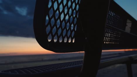 A-park-bench-empty-at-dusk-in-spring