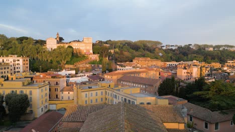 Aerial-Pullback-Reveals-Basilica-of-Santa-Maria-in-Trastevere-at-Sunrise-in-Rome,-Italy