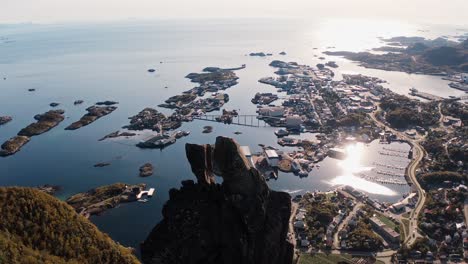 Beautiful-aerial-view-of-Svolvær-with-Svolværgeita-in-the-foreground,-on-a-sunny-day,-Lofoten-Islands,-Norway