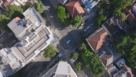 Top-down,-aerial-footage-rotating-over-an-intersection-in-Copacabana-in-Rio-de-Janeiro