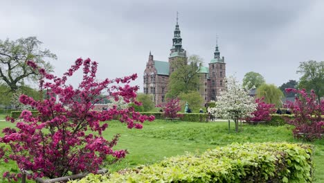 Frederiksborg-Castle-of-Copenhagen-with-Colorful-Trees-in-Danish-Spring-Season