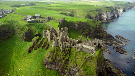 Aerial-shot-of-Dunluce-Castle,-in-Bushmills-on-the-North-County-Antrim-coast-in-Northern-Ireland