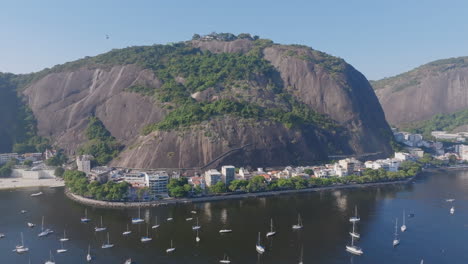 Slow-aerial-pan-up-of-the-Morro-da-Urca-in-Rio-de-Janeiro,-Brazil