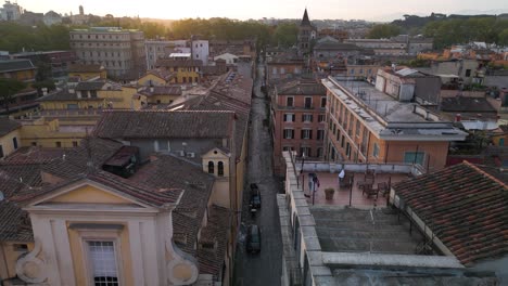 Cinematic-Establishing-Drone-Shot-Above-Historic-Neighborhood-in-Rome,-Italy-at-Sunrise