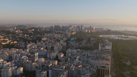 Aerial-flyover-of-the-apartment-buildings-and-skyscrapers-of-Rio-de-Janeiro-with-central-downtown-in-the-background