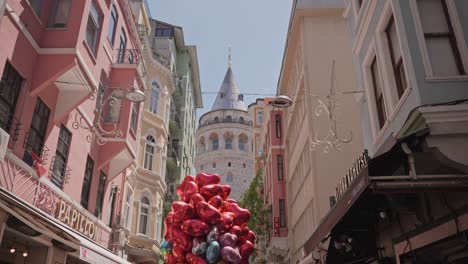 The-historical-Galata-Tower-visible-between-buildings-in-Istanbul,-Turkiye