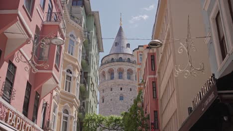 The-historical-Galata-Tower-visible-between-buildings-in-Istanbul,-Turkiye