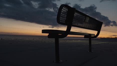 Handheld-view-of-a-bench-during-dusk