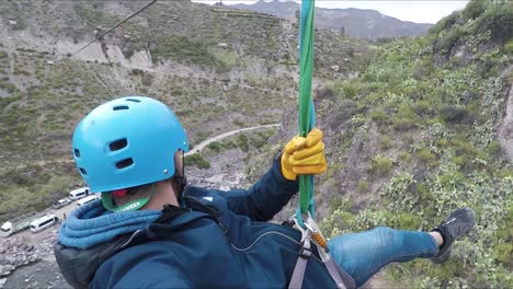 Young-man-smiles-as-he-goes-down-a-zip-line-in-Peru