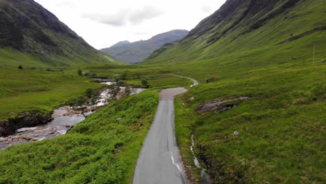 Low-Drone-Aerial-of-Porsche-Turbo-near-Glencoe-and-Glen-Etive