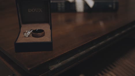 Bride-and-Groom-Wedding-Rings-Laying-Together-in-a-Jewelry-Box