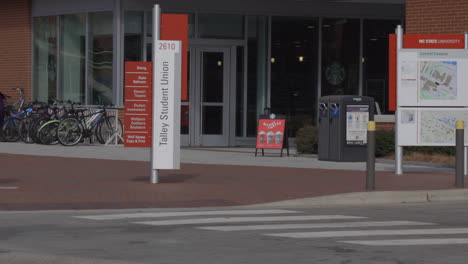 Vehicles-Driving-And-Passing-By-The-Talley-Student-Union-At-North-Carolina-State-University-In-Raleigh,-North-Carolina