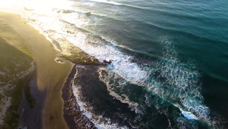 Waves-breaking-in-the-shore-during-sunset-at-Matanzas-beach,-Navidad-region-in-the-south-of-Chile