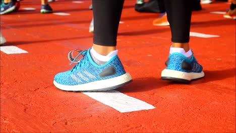 QUEZON-CITY,-PHILIPPINES-–-JULY-9,-2019:-Handheld-close-up-video-shot-of-a-person’s-foot-wearing-running-shoes-doing-dance-exercise