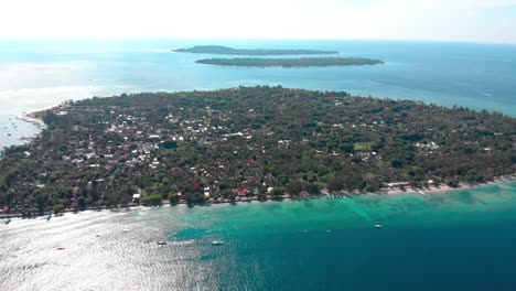 high-aerial-drone-fly-over-small-bali-island-revealing-three-small-islands-in-a-line