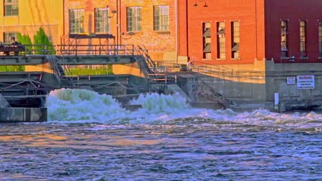 Slow-motion-of-the-Beloit-Dam-during-sunset,-stunning-light,-rough-water,-rapids